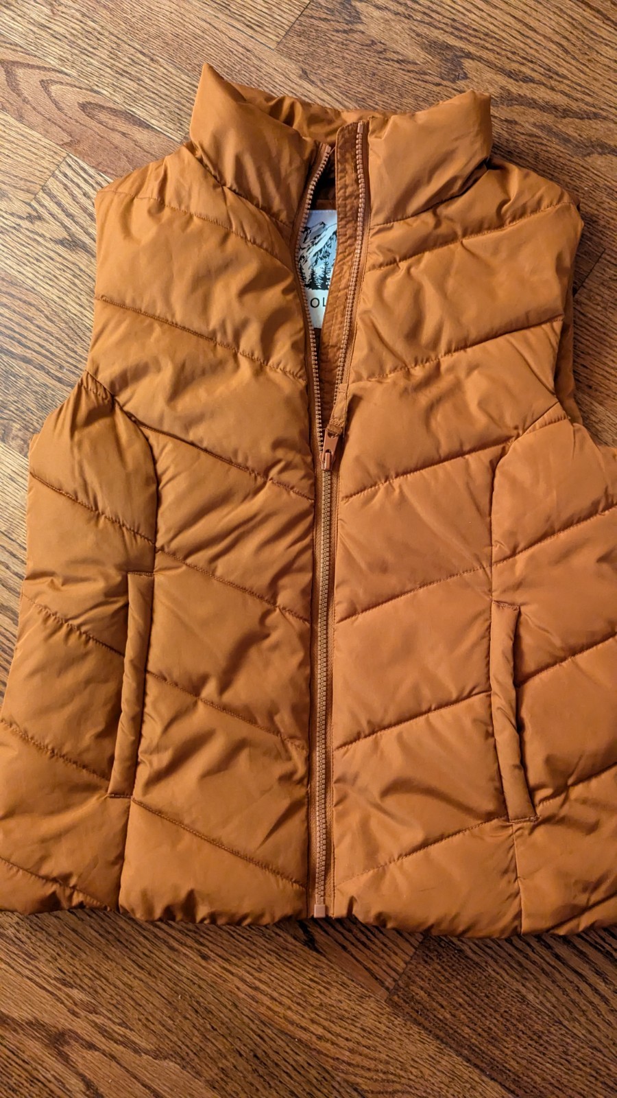 Cole Haan women’s orange gilet puffer vest