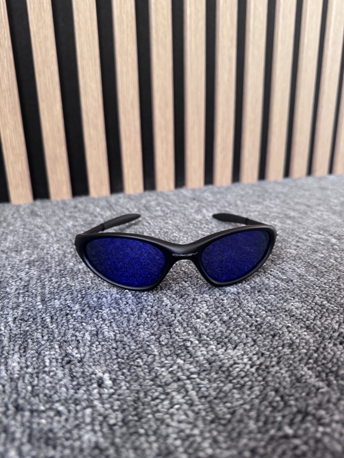 Oakley Minute sunglasses unisex black frame with blue see trough lenses