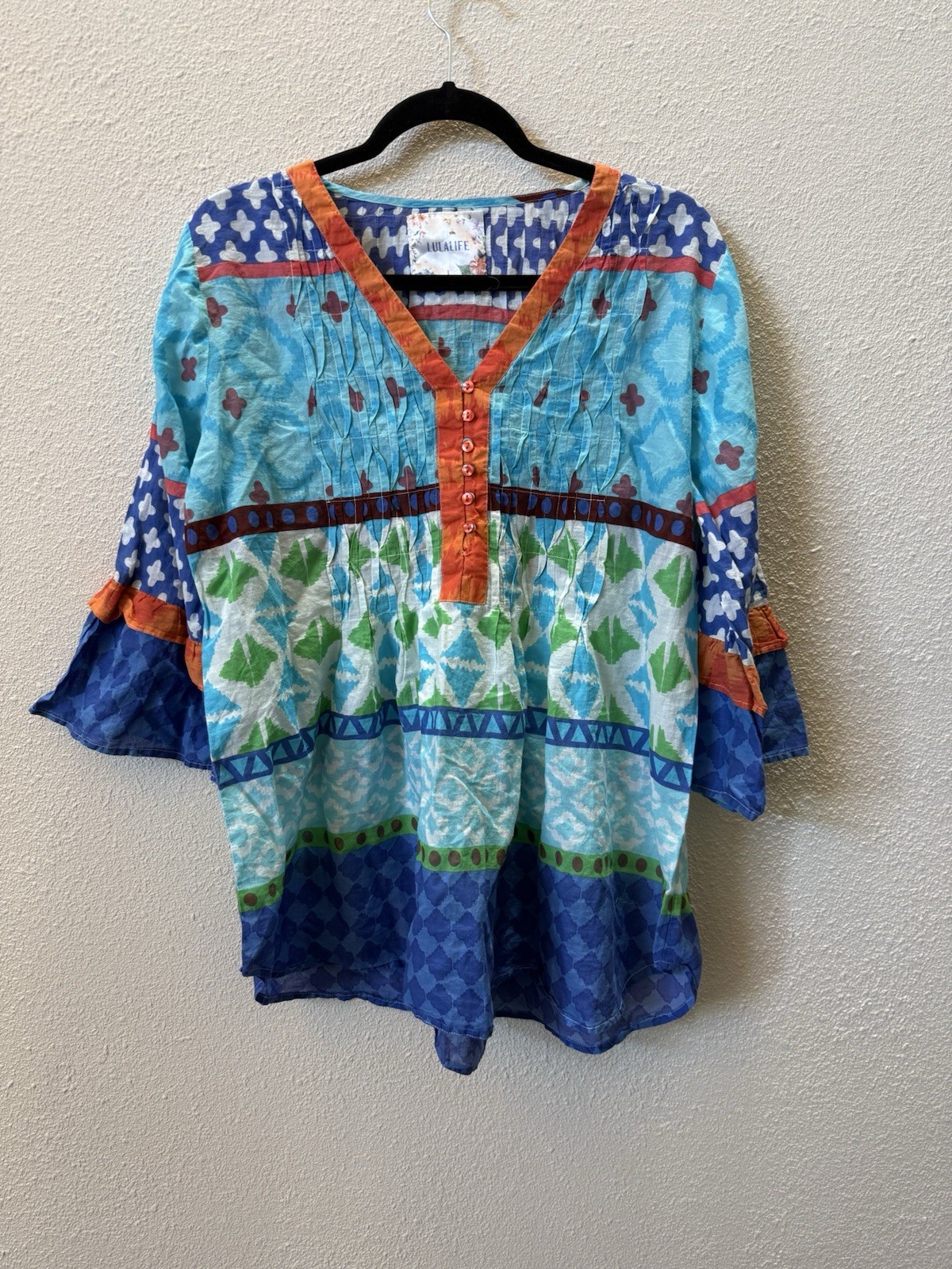 NWT LulaLife vibrant, multi-patterned top cotton v-neck Button closures. Size: L