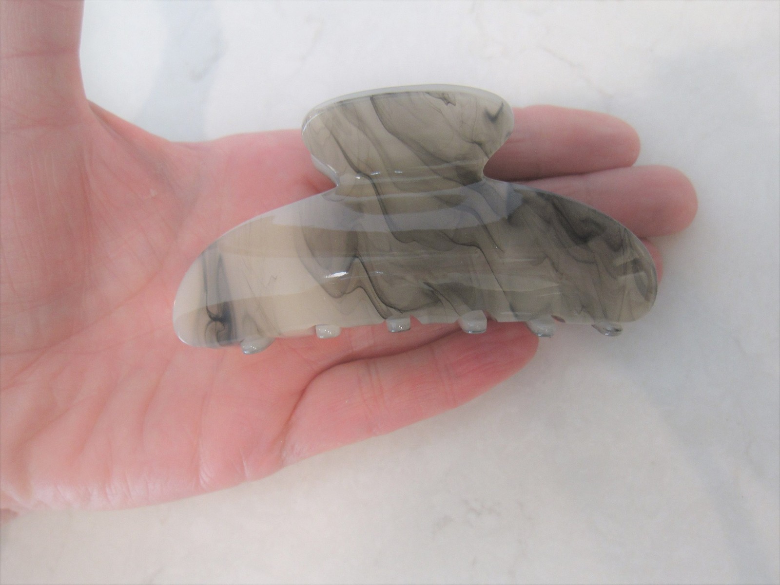 One random marbled beige white black gray acrylic hair claw clip