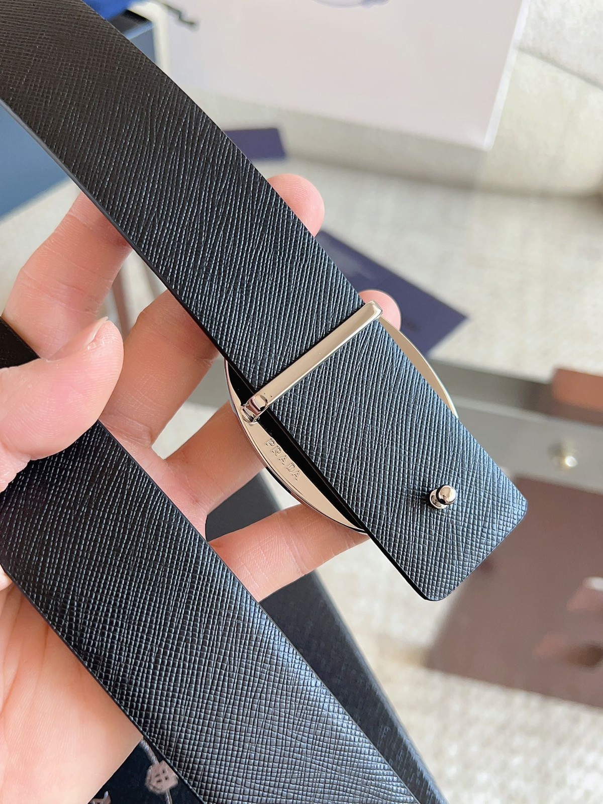 Prada men’s black-button black leather belt