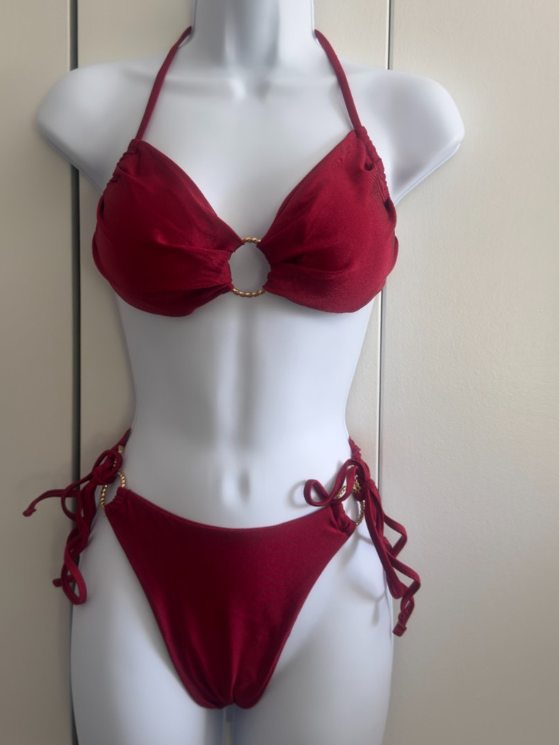 Women’s two-piece swimsuits in burgundy, mustard, and black.