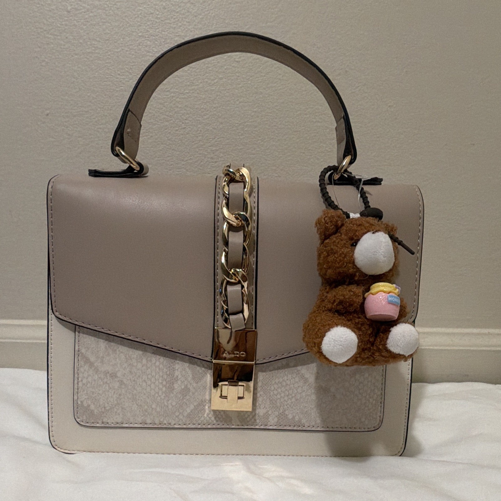 ALDO Beige Solid Top Handle Bag Turn Lock Gold Hardware Chain Teddy Charm