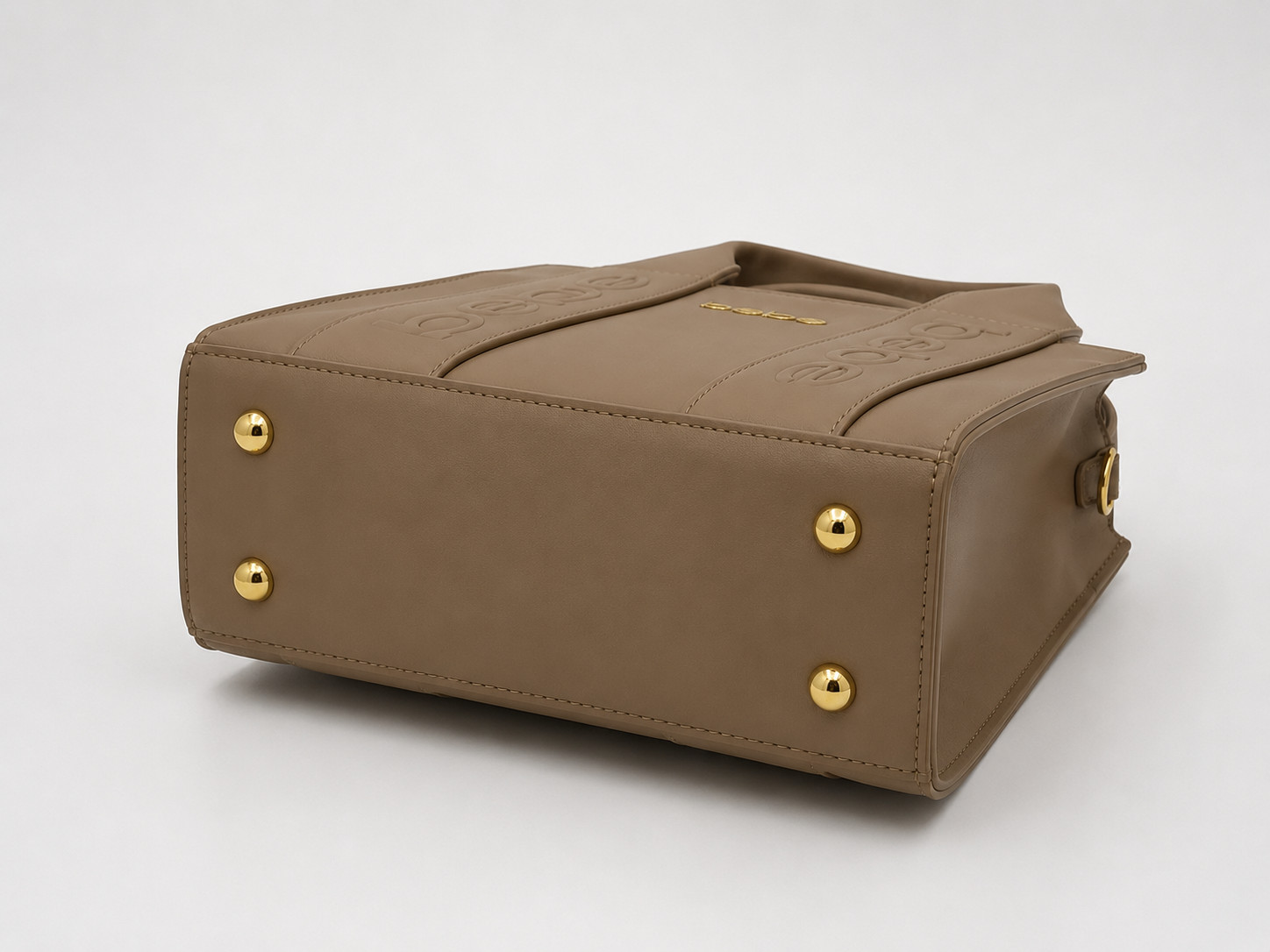 Elevate your style with this structured top-handle bag featuring sparkling logo