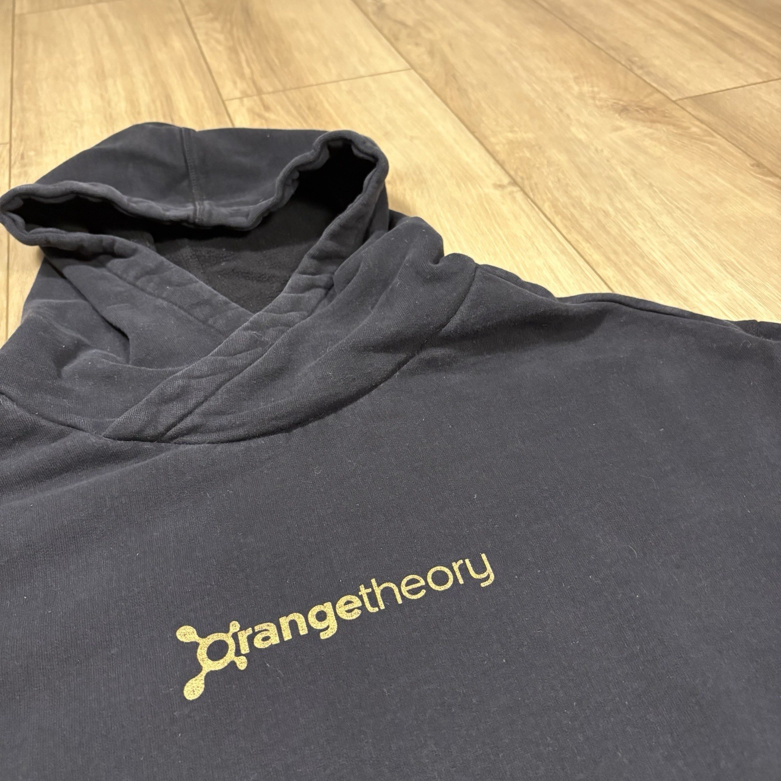 Orange Theory FITNESS Black Pullover Cold Elbow Gold Foil Star Sweatshirt M