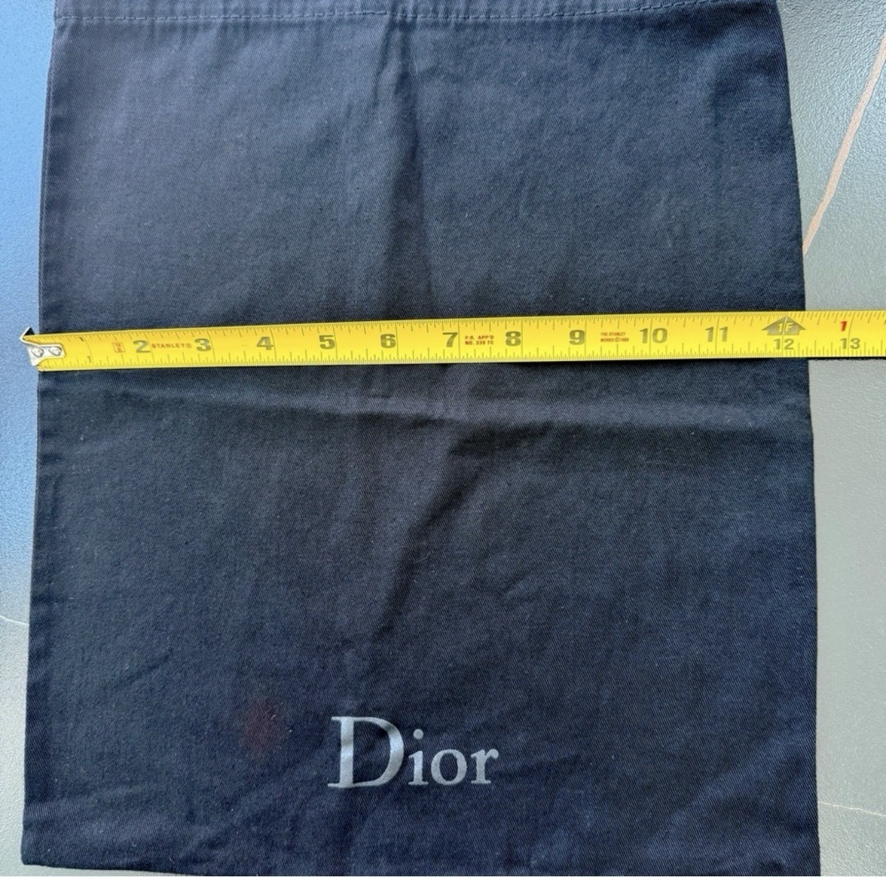 Dior original dust bag in black approximately 14.5 x 12 inches.