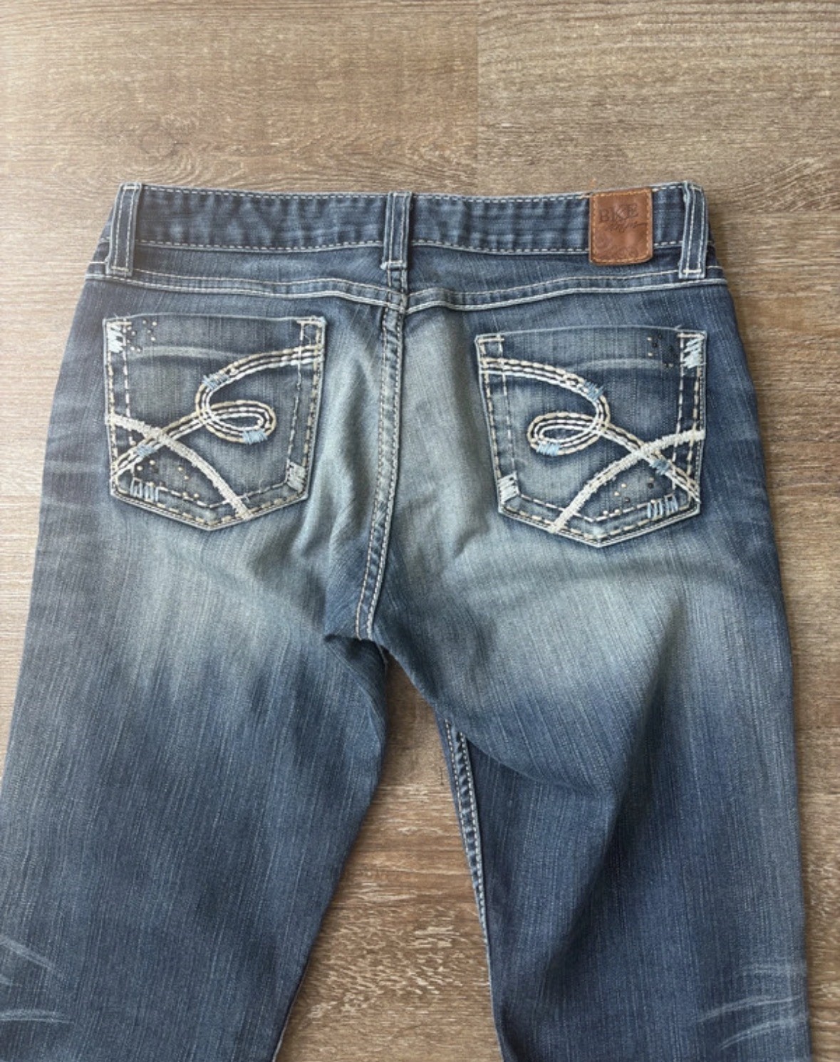 Y2K VTG BKE blue low rise bootcut flare jeans with white stitching back pockets