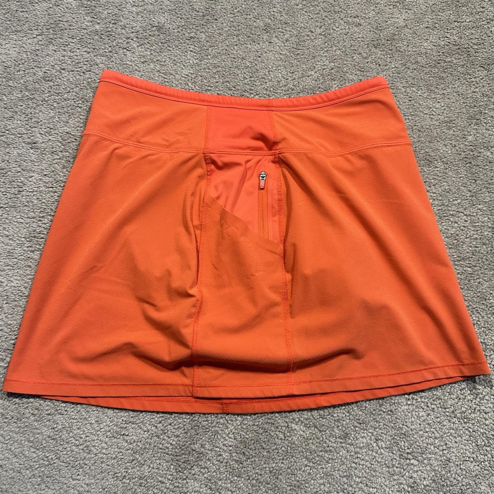 ATHLETA Action Skort in Dobby 14.5 Womens Small Orange Pockets Stretch Athletic