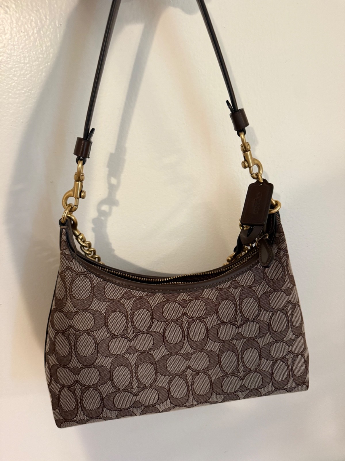 Brown and tan coach bag gently used. With brown stitching and gold hardware.