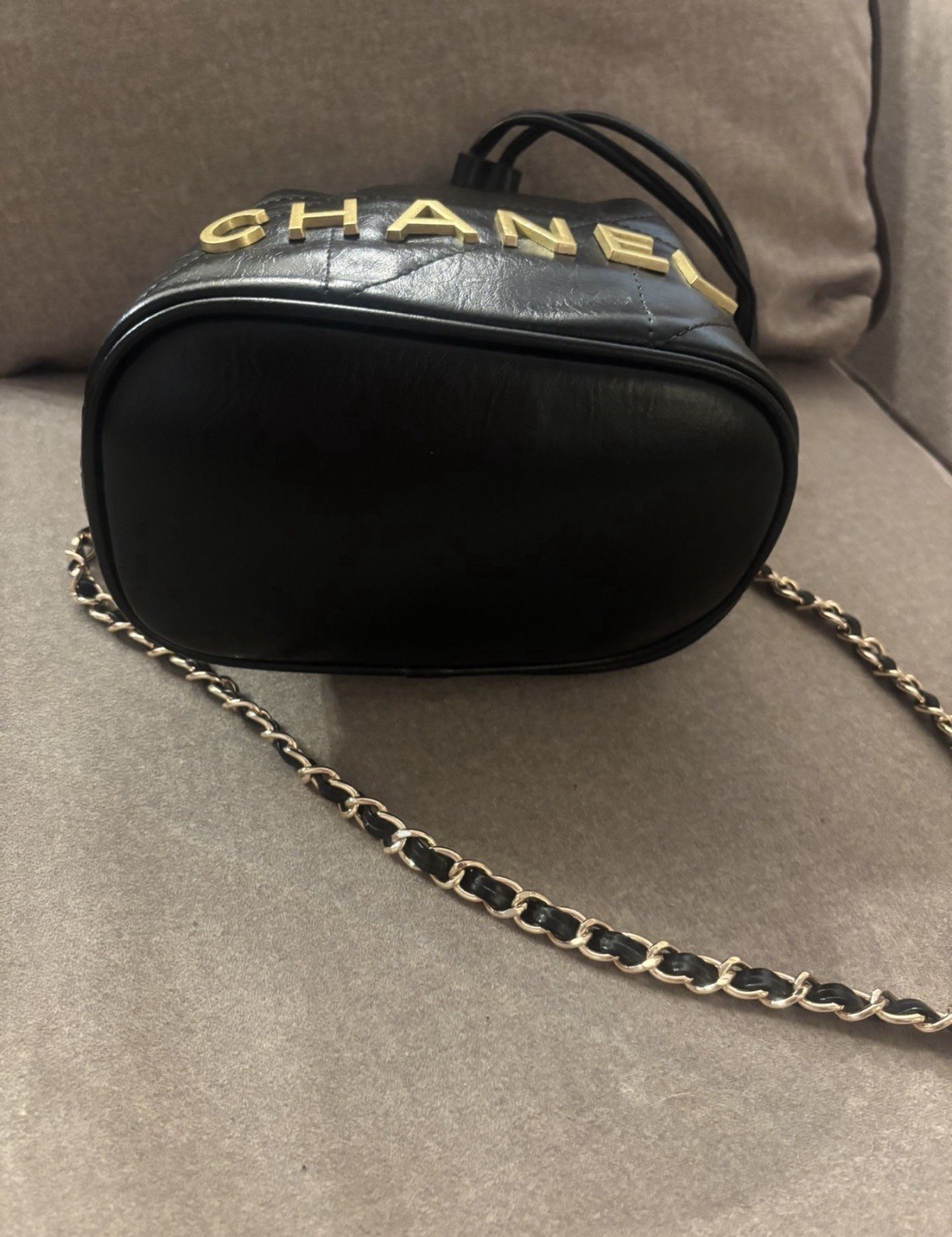 CHANEL Mini Black Quilted Drawstring Bucket Bag with Gold Chain Strap Charm