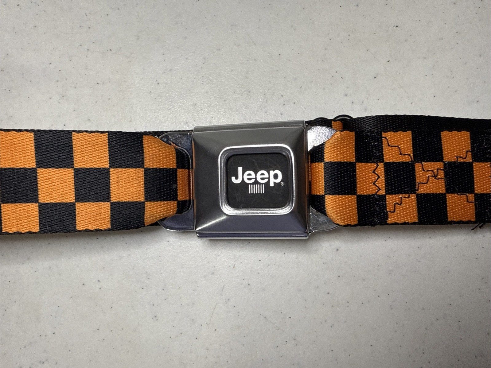 Buckle Down Seatbelt JEEP Logo Adjustable Belt Orange & Black Checkers Adult