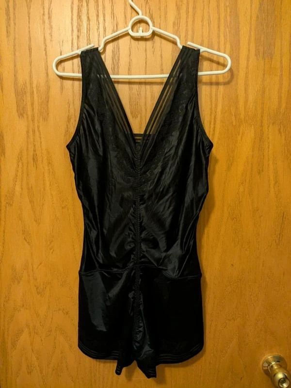 A women’s firm-control mid-thigh bodysuit shapewear garment.