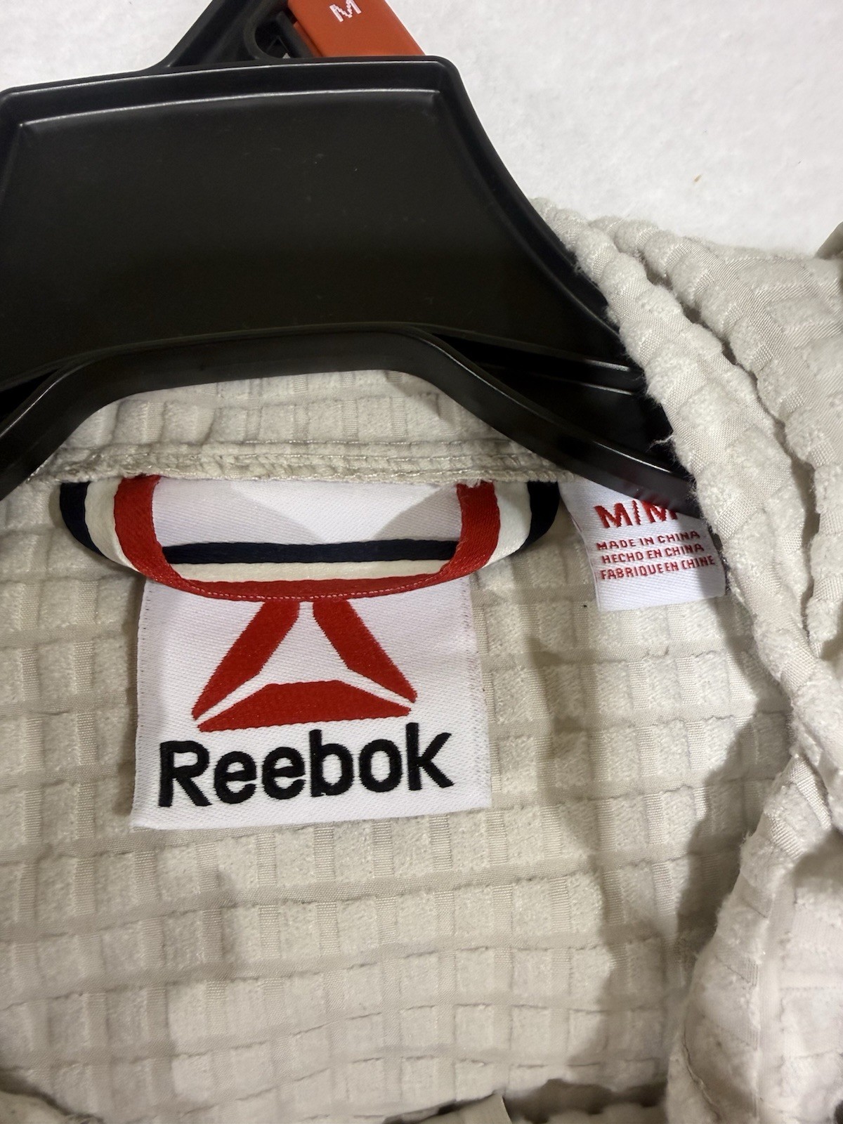 Reebok Men’s Textured Stretch Hooded Jacket, Windbreaker Driftwood Black M-3XL