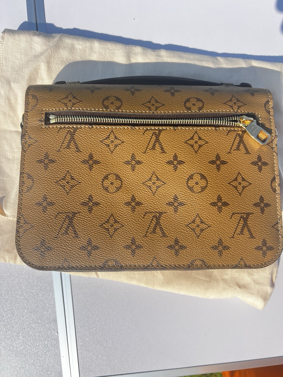 Louis Vuitton Pochette Métis Reverse Monogram Brown/Tan Satchel Push Lock