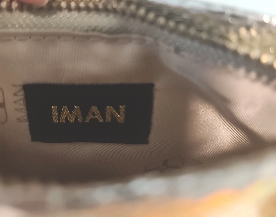 IMAN Metallic Metal Mesh Mini Clutch Silver Zippered Side Open Logo Metal Pull
