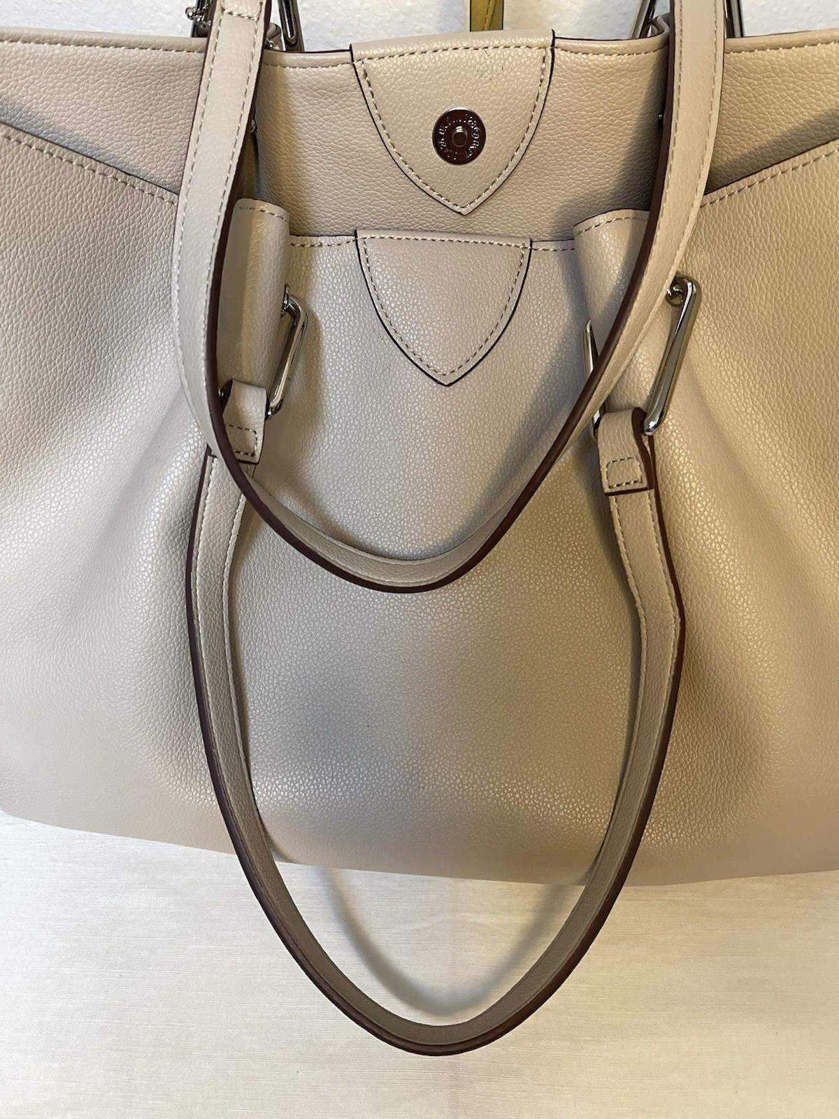 Anne Klein Taupe Vegan Pebbled Texture Tote with Lion and Tassel Charms