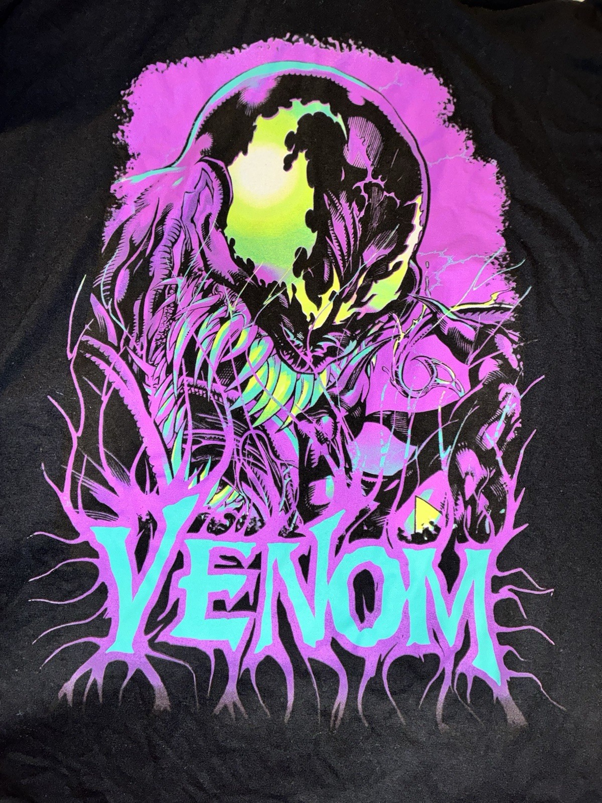 Marvel: black crewneck tee with vibrant neon purple, green, and teal Venom print