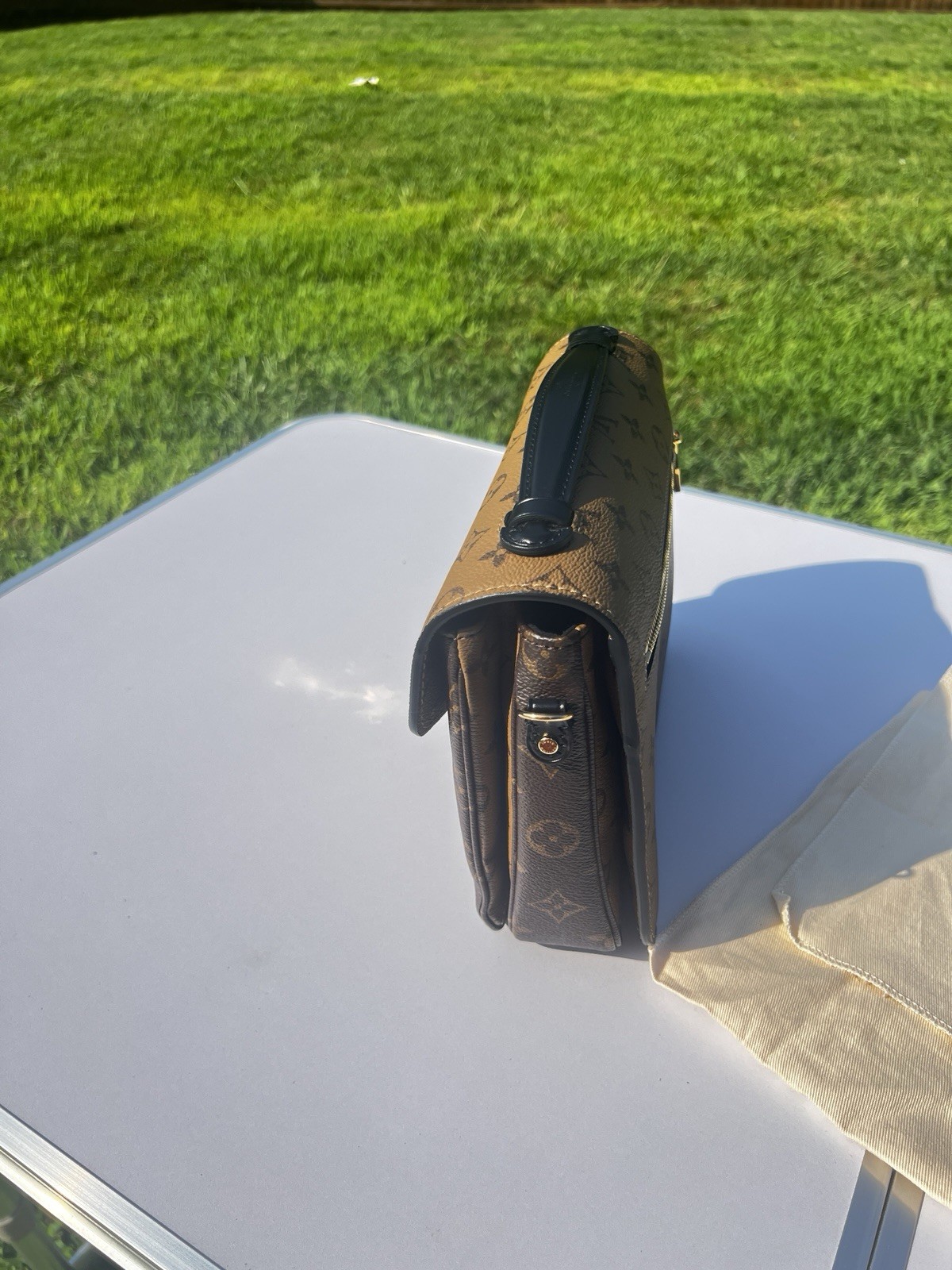 Louis Vuitton Pochette Métis Reverse Monogram Brown/Tan Satchel Push Lock