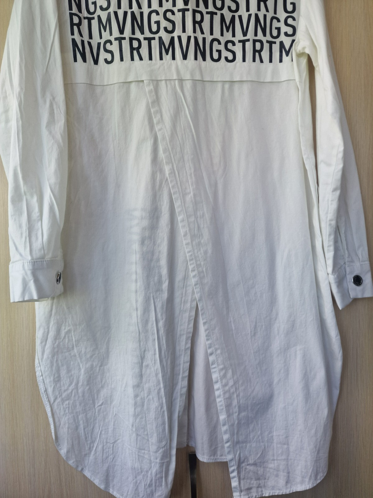 women’s shirt,size 48,white,long,with buttons,long sleeves,buttons on the side