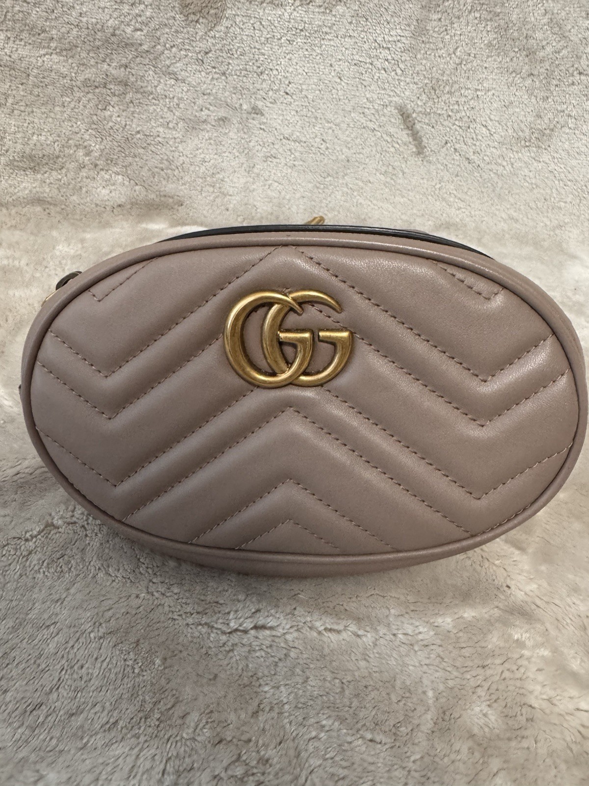 iGucci GG Marmont Matelasse Belt Bag in nude color with aged gold-tone hardware.