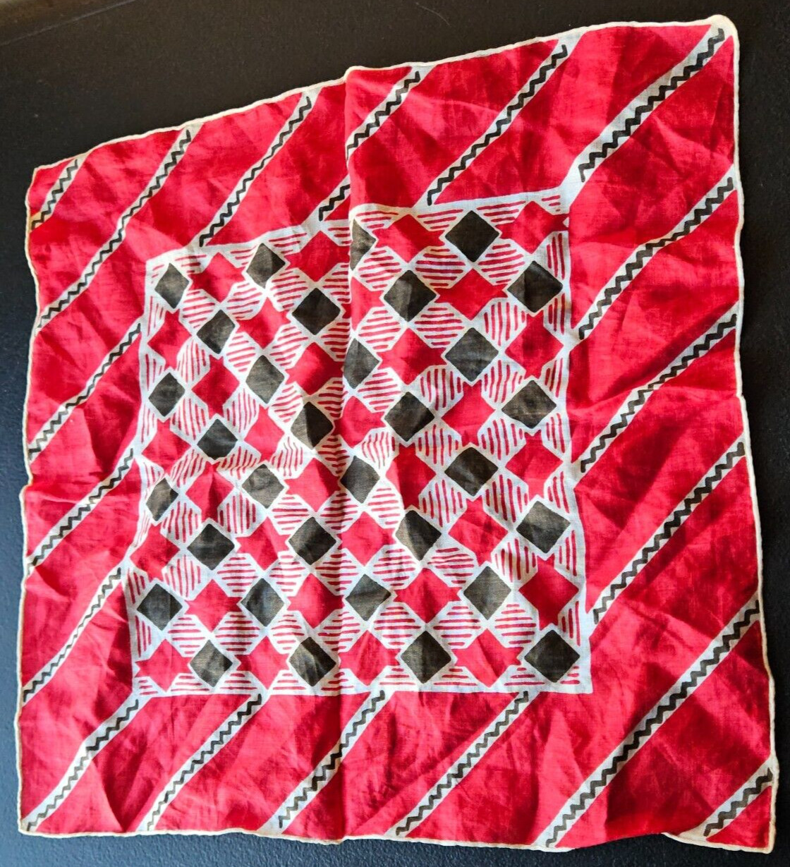 RED, BLACK, WHITE MULTI DESIGN EMBROIDERED EDGE HANDKERCHIEF. 12 1/2 IN.