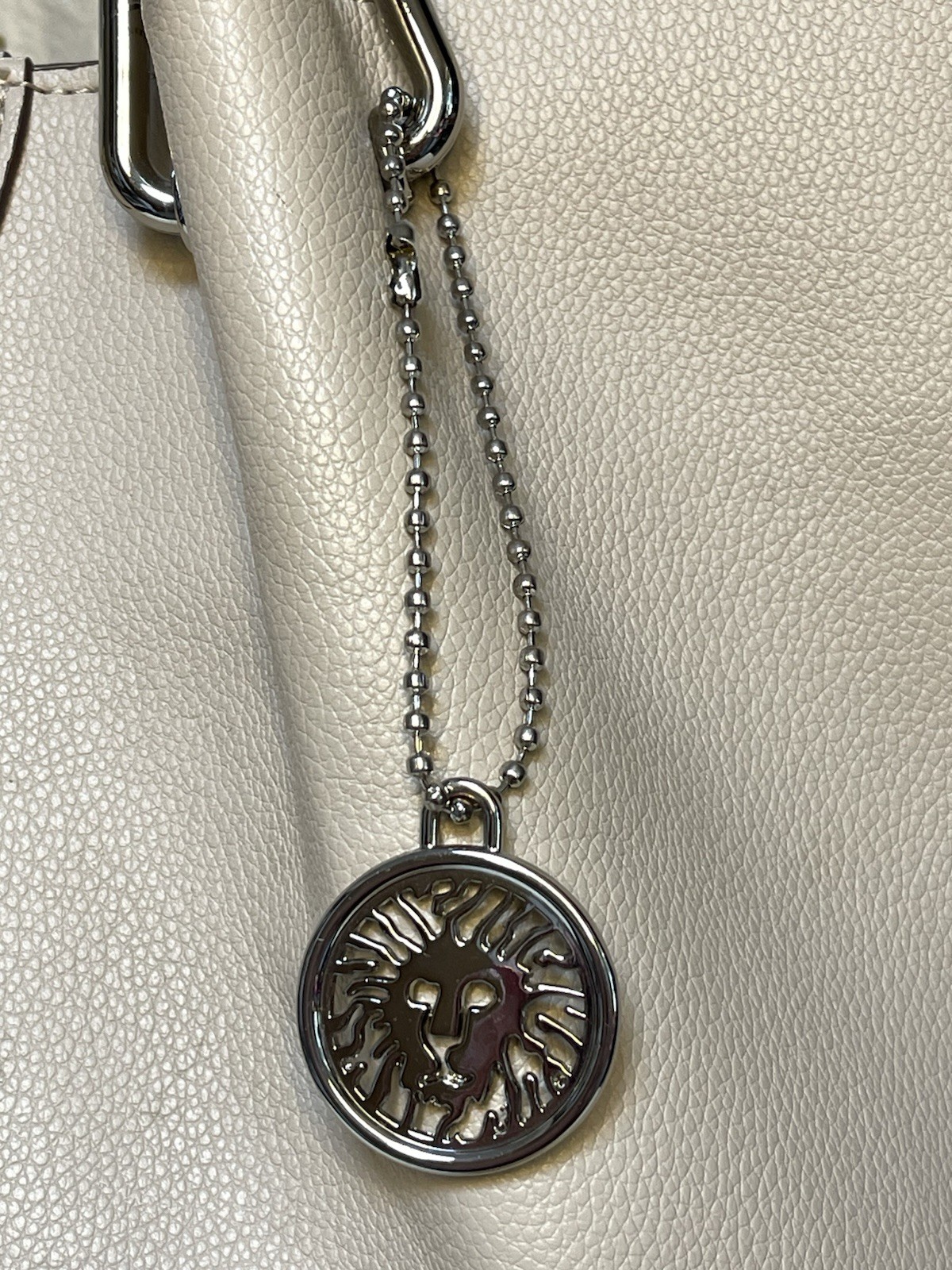 Anne Klein Taupe Vegan Pebbled Texture Tote with Lion and Tassel Charms