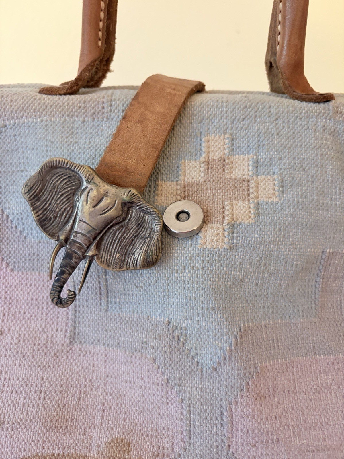Vintage The Elephant Walk handbag with leather straps and metal elephant clasp