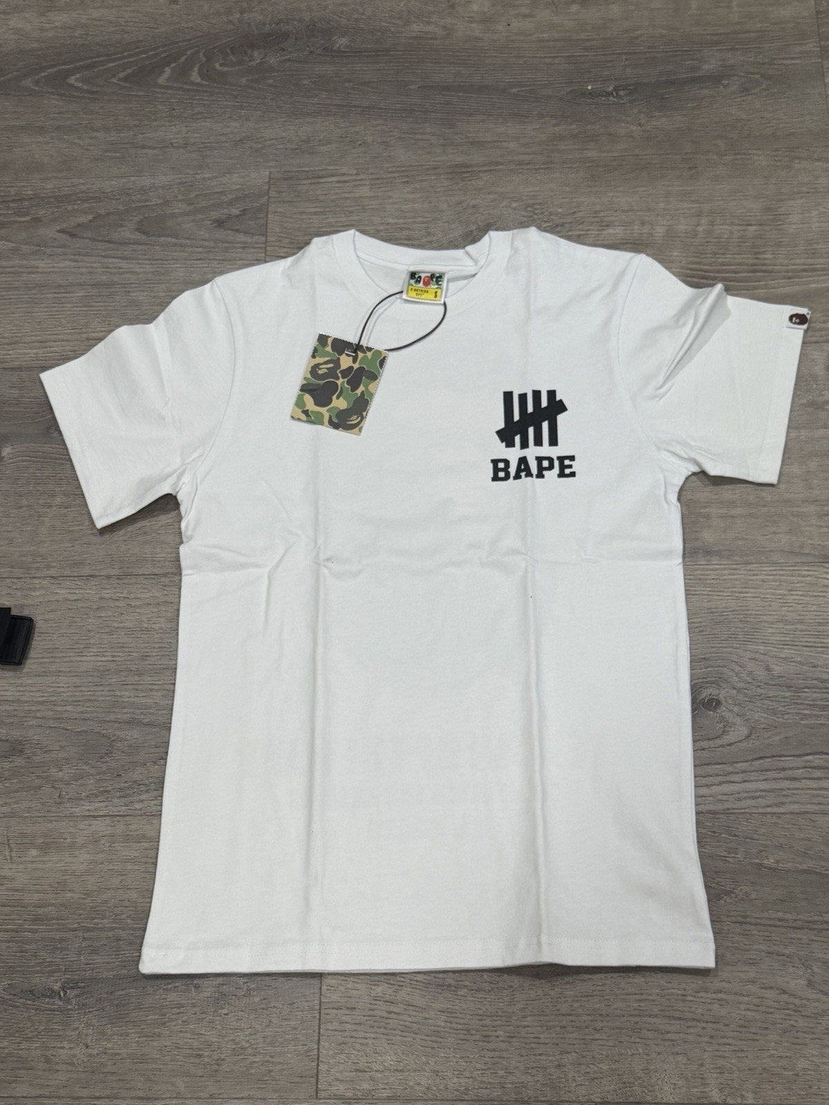 BAPE × undefeated logo T-shirt White A Bathing Ape Size S