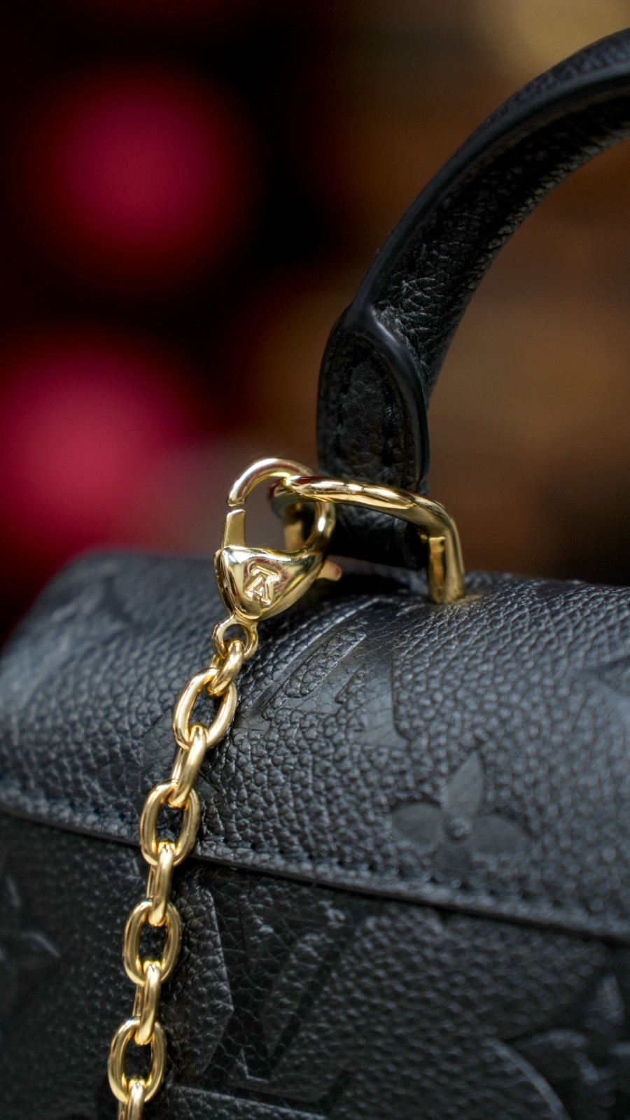 LOUIS VUITTON Madeleine Monogram Empreinte Top Handle Chain Shoulder bag Women