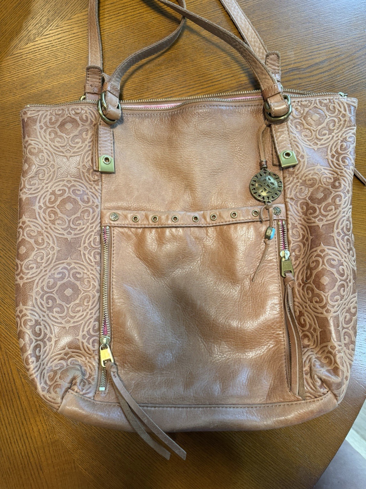 The Sak Brown Embossed Floral Tote Bag Zip Top Purple Lining Pockets Tassel