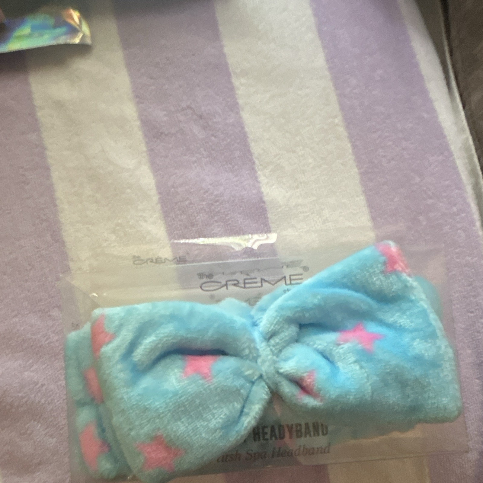 the Crème shop Plush Spa Headband, Blue Pink Stars Pattern Bow Accent