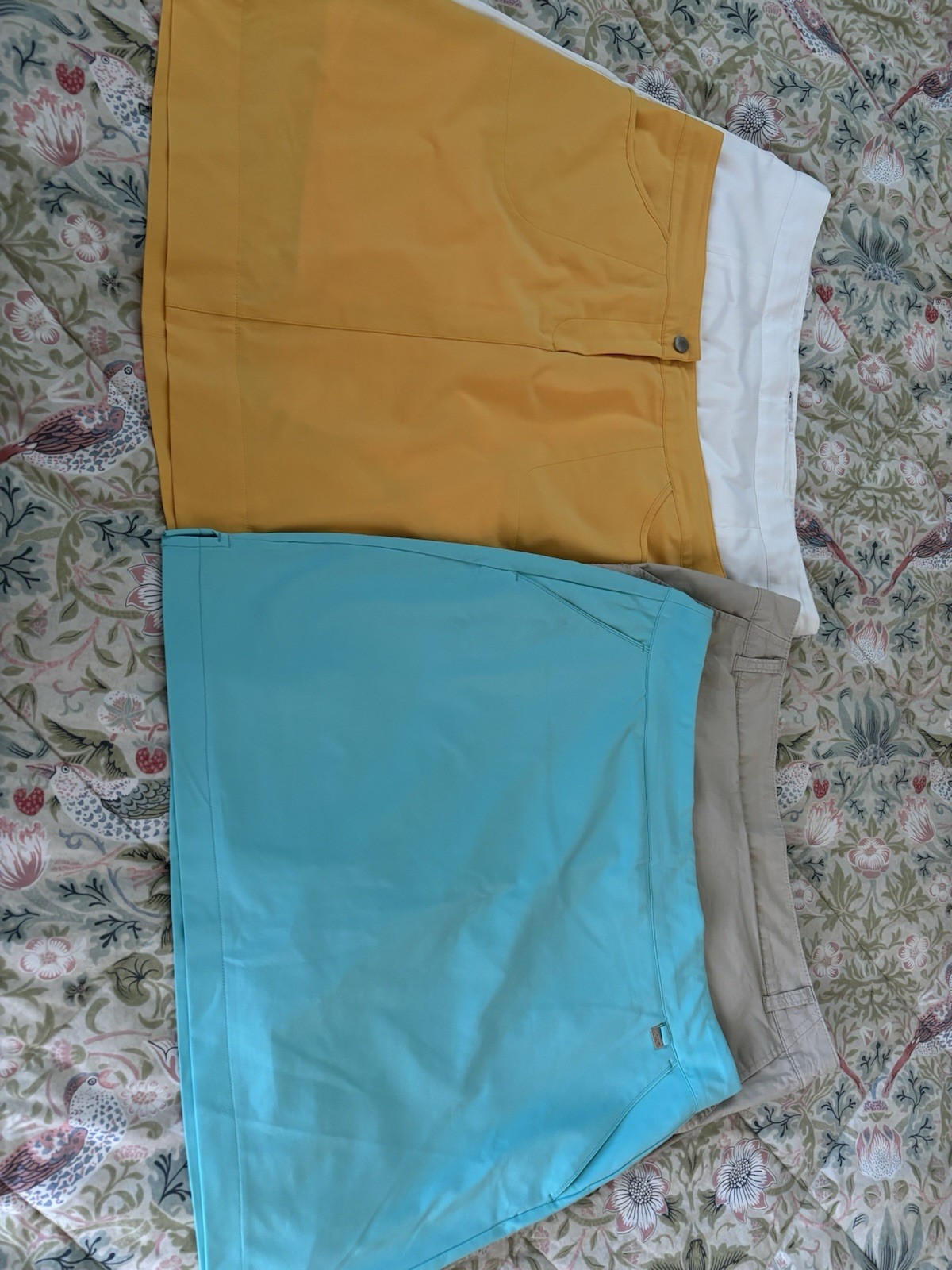 Womens Skorts (4). White, turquoise, tan and yellow. Size 12.