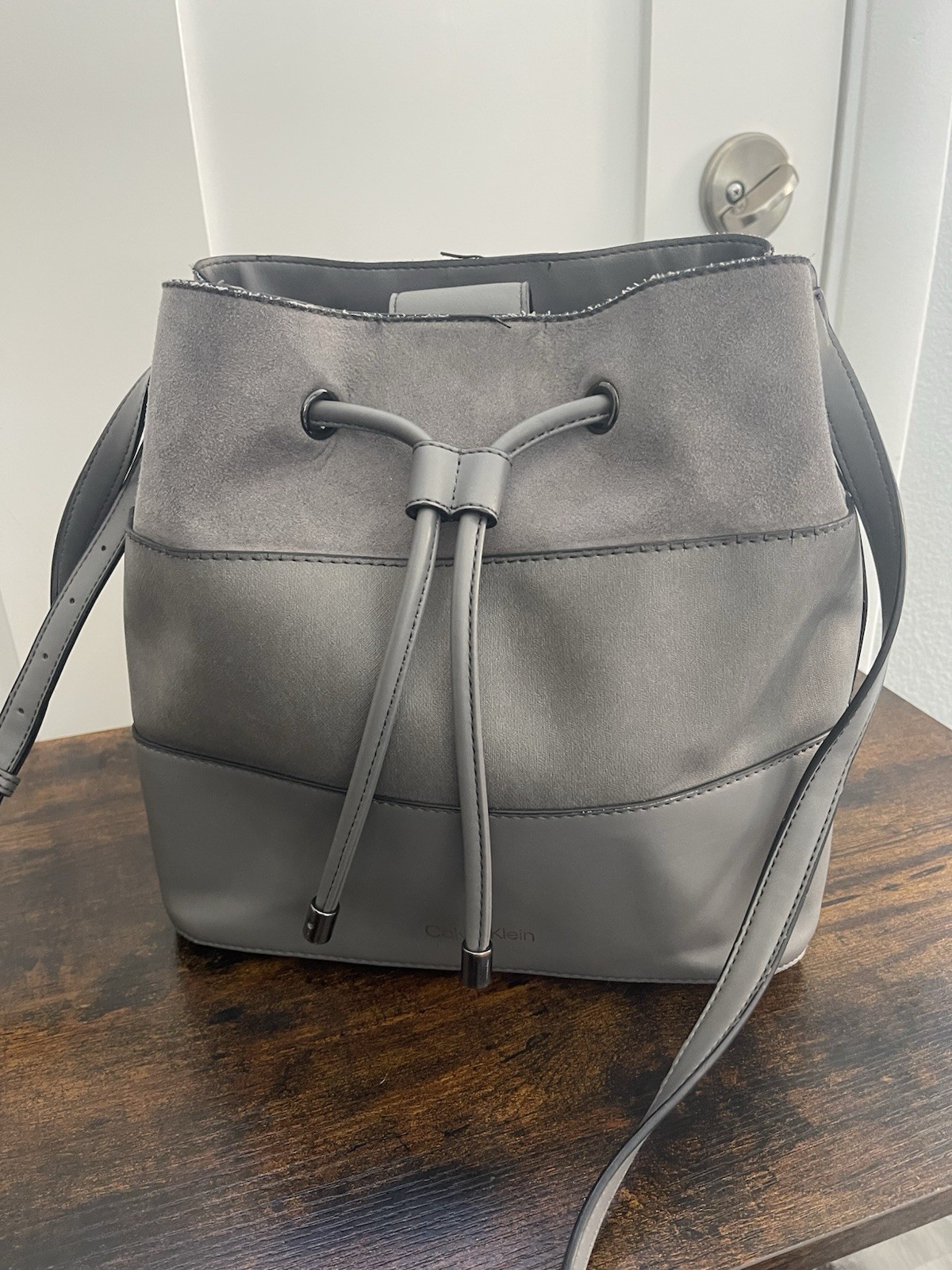 Calvin Klein Gray Drawstring Bucket Crossbody Bag Adjustable Strap Silver Logo