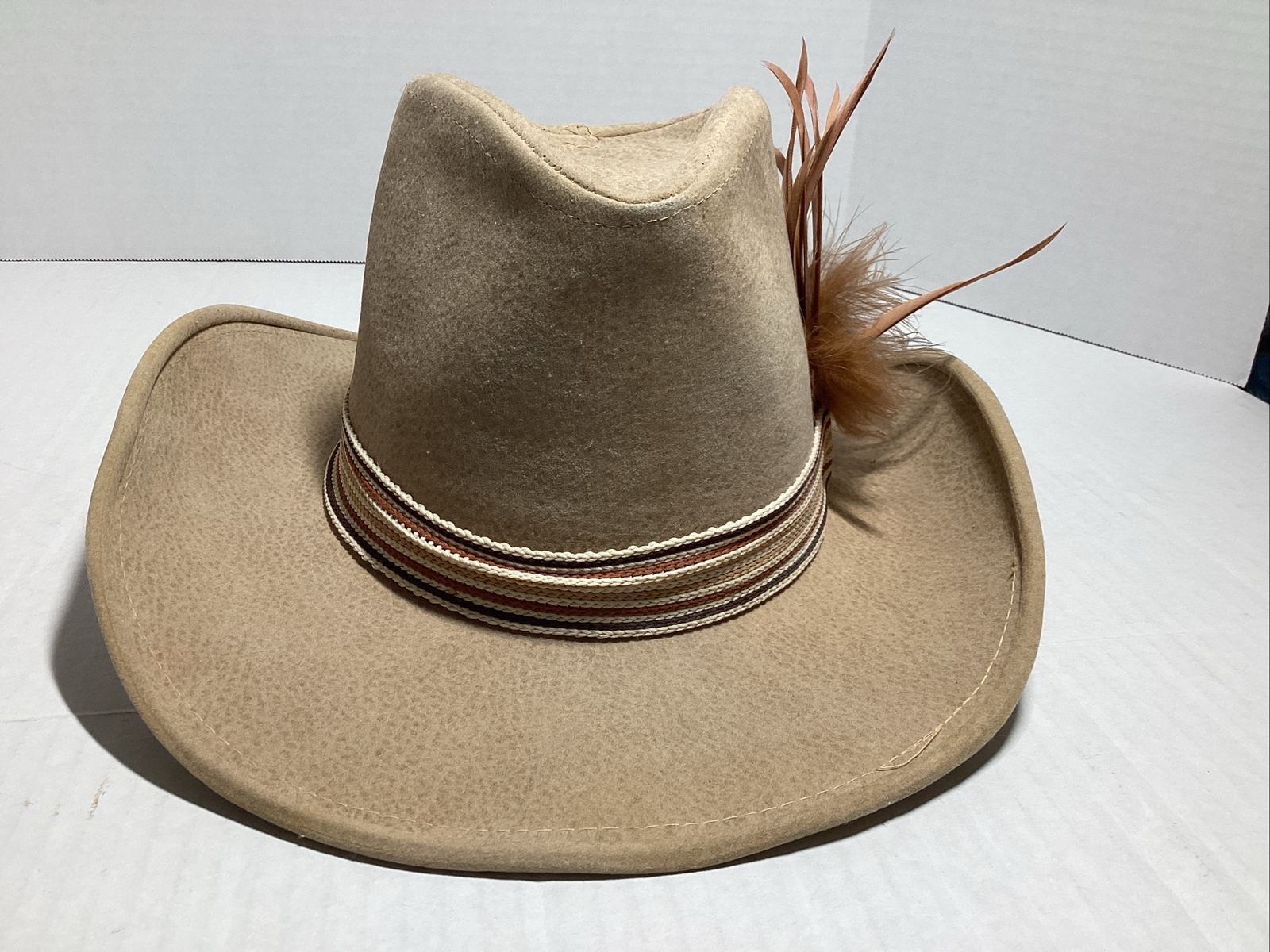 VTG Western Cowboy hat, Size Small, Head Measures 8 By 6 Inches, Tan, Feathers