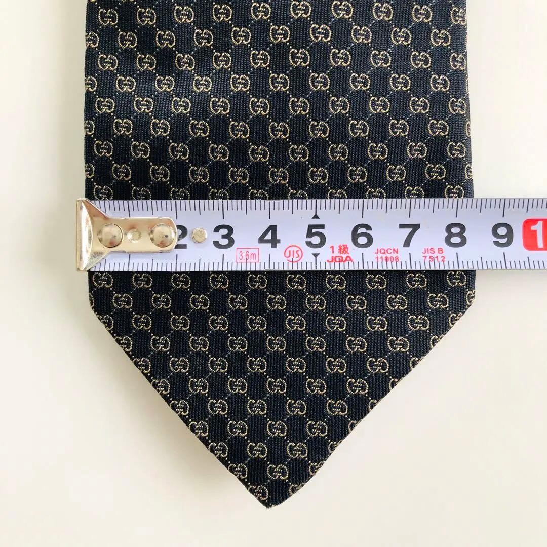 GUCCI Emblem Pattern Silk Tie Black Bronze 8.3cm Wide 154cm Long Pre-owned