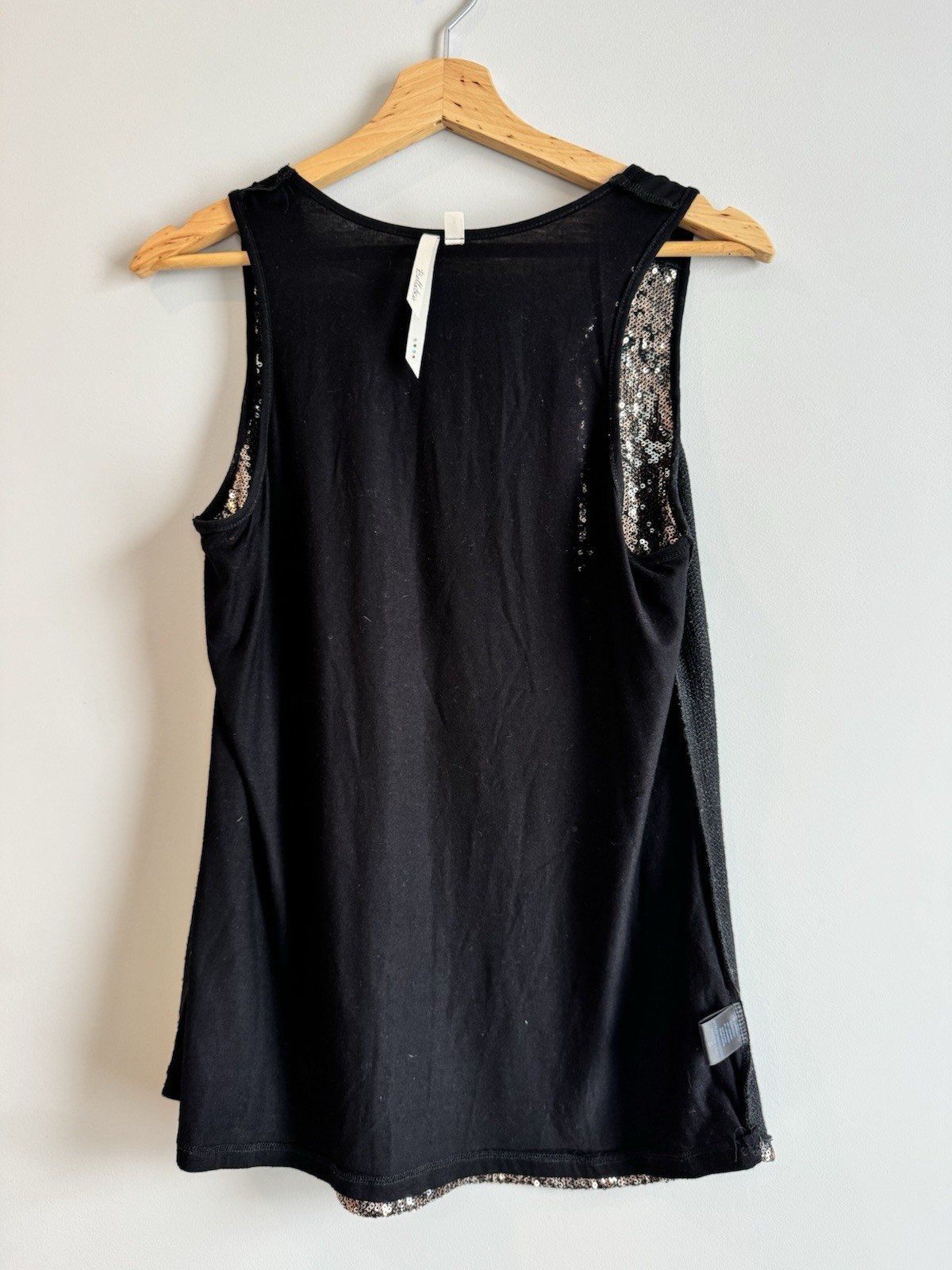 Bellatrix copper – silver sequined front with a contrasting solid black back.
