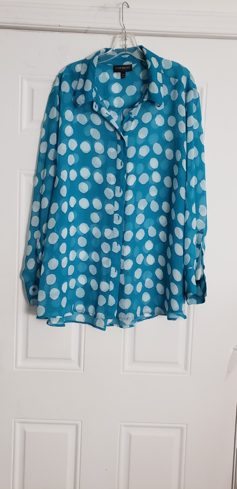 Lane Bryant sheer turquoise and white polka dot button-down blouse. It is…