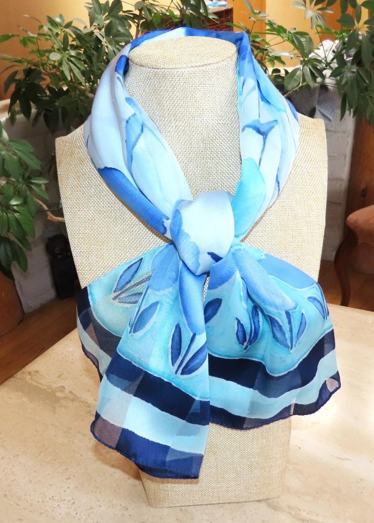 Oblong floral scarf; blue tones, white; 60×14.5 in. Semisheer; poly blend?