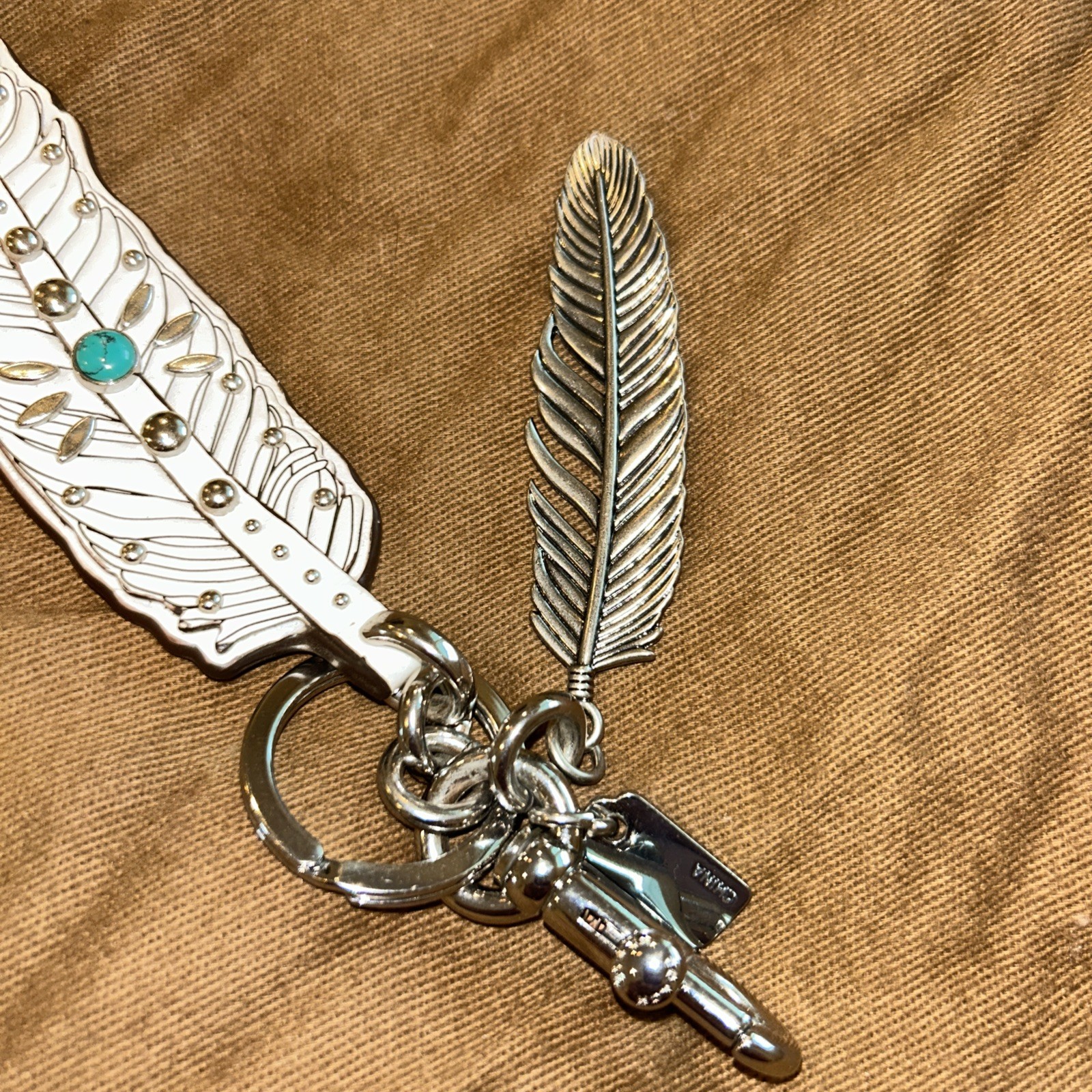 Coach Rare Turquoise and Silver Feather Hang Tag. Excellent Condition