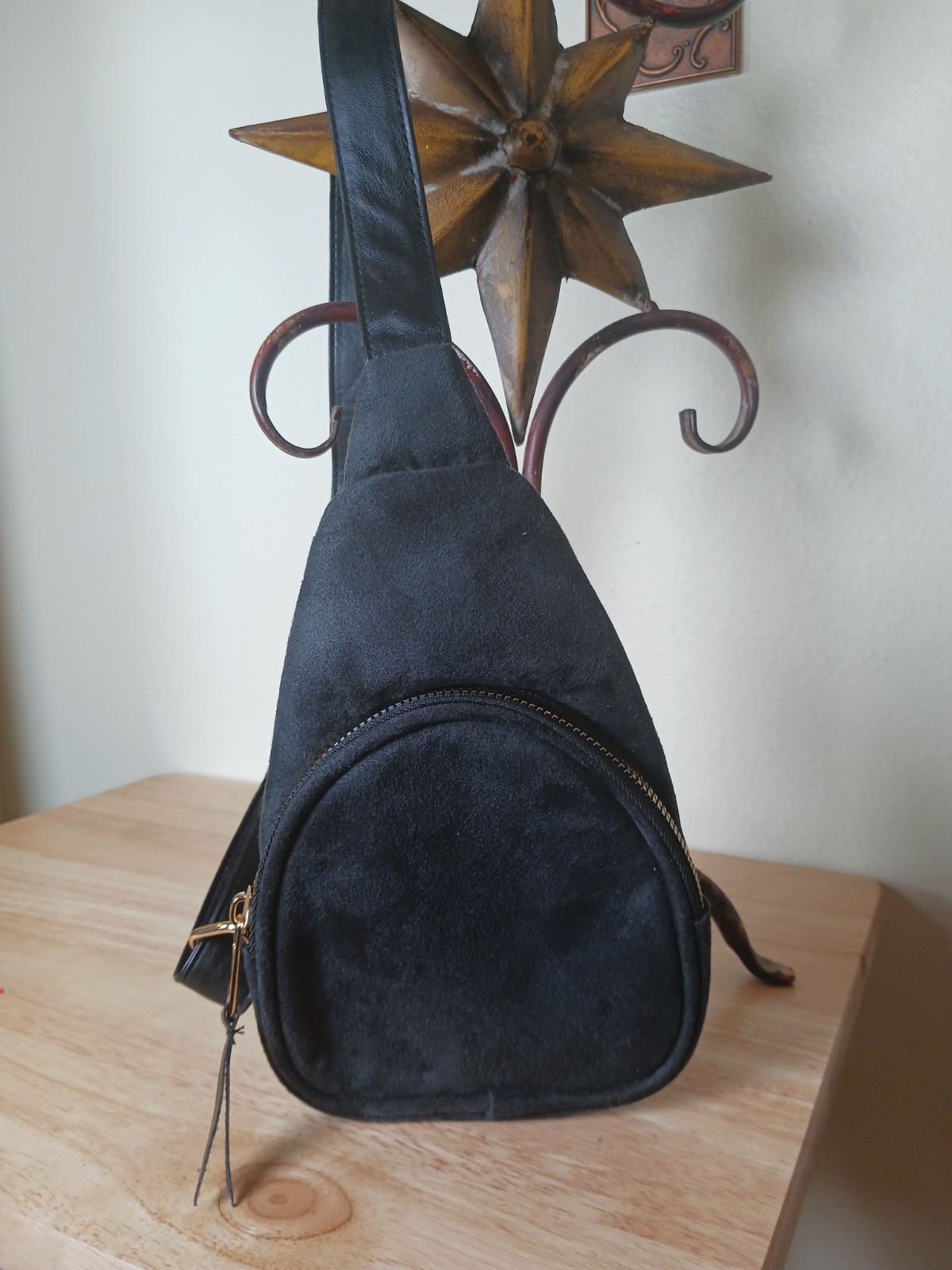 Black Sling Bag with Shoulder Strap and Gold Hardware Zipper Accent