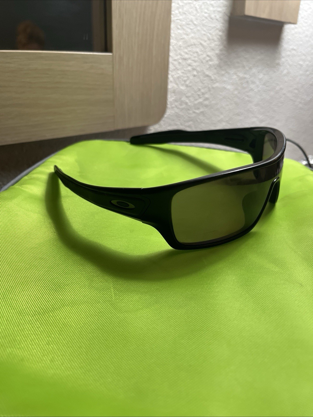 Oakley Men’s Wrap Sunglasses Black Plastic Frame, Tinted Black Lenses 03-909