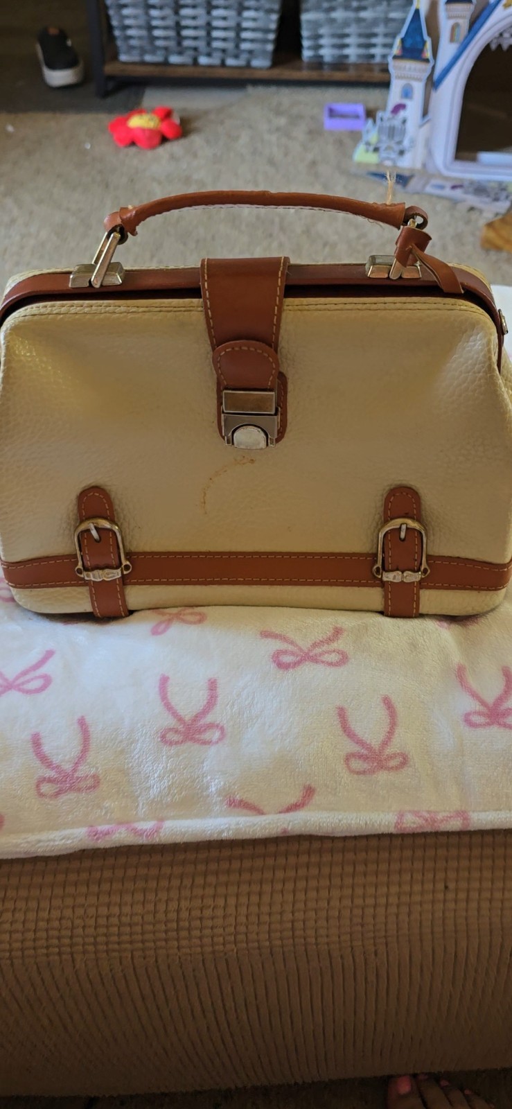 Dooney And Bourke Vintage all weather leather purse. 11 inches across and 7 t