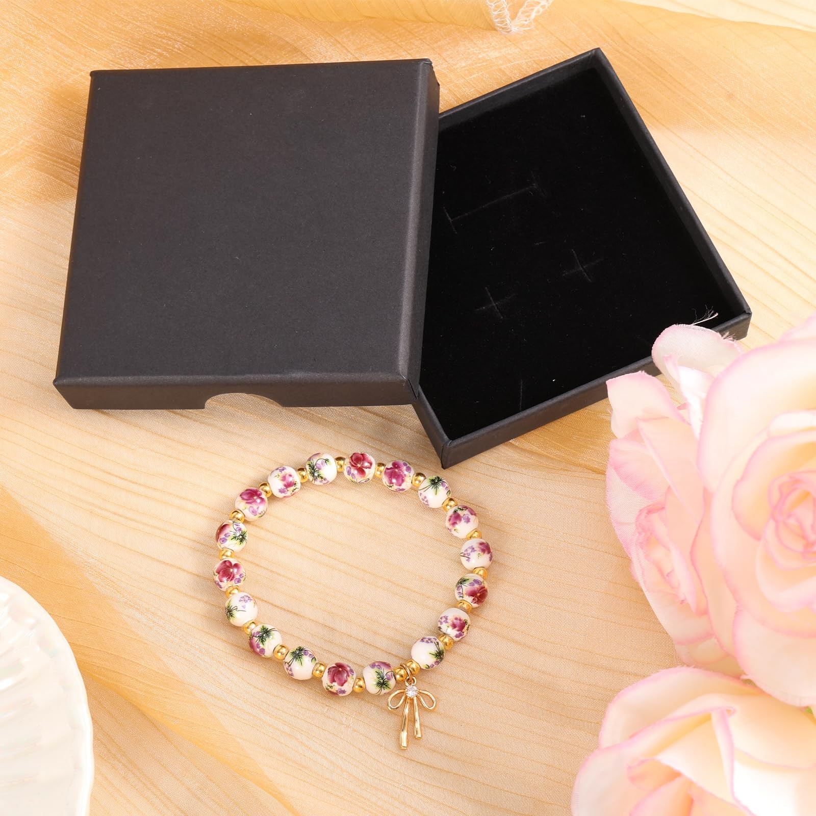Mikovivi Beads Bow Charm Bracelet Medium, as shown in the detailed picture
