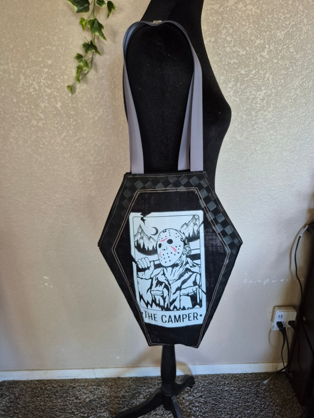 Edgy coffin-shaped tote bag with Camper graphic and waterproof canvas lining.