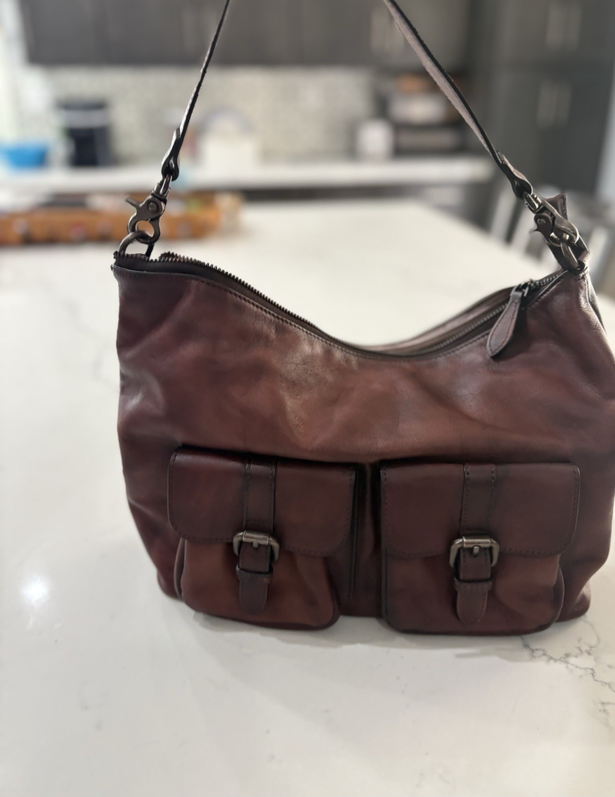 Elevate your style with this chic burgundy leather shoulder bag.