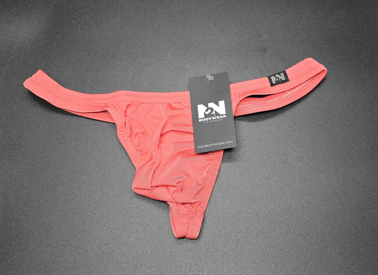N2N Bodywear Men’s Dreamy Thong Underwear. M Salmon Pink NWT