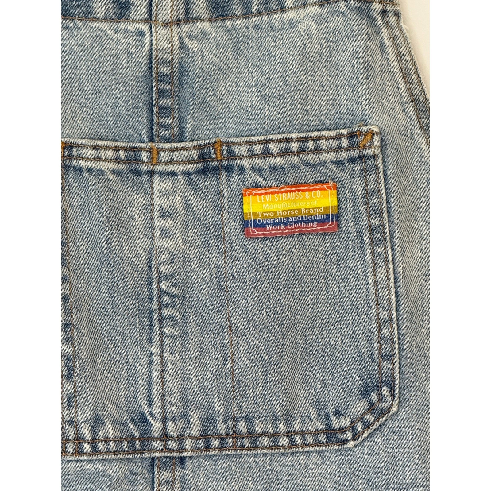 Levi’s Pride Liberation Shortalls Overall Shorts in a light acid wash