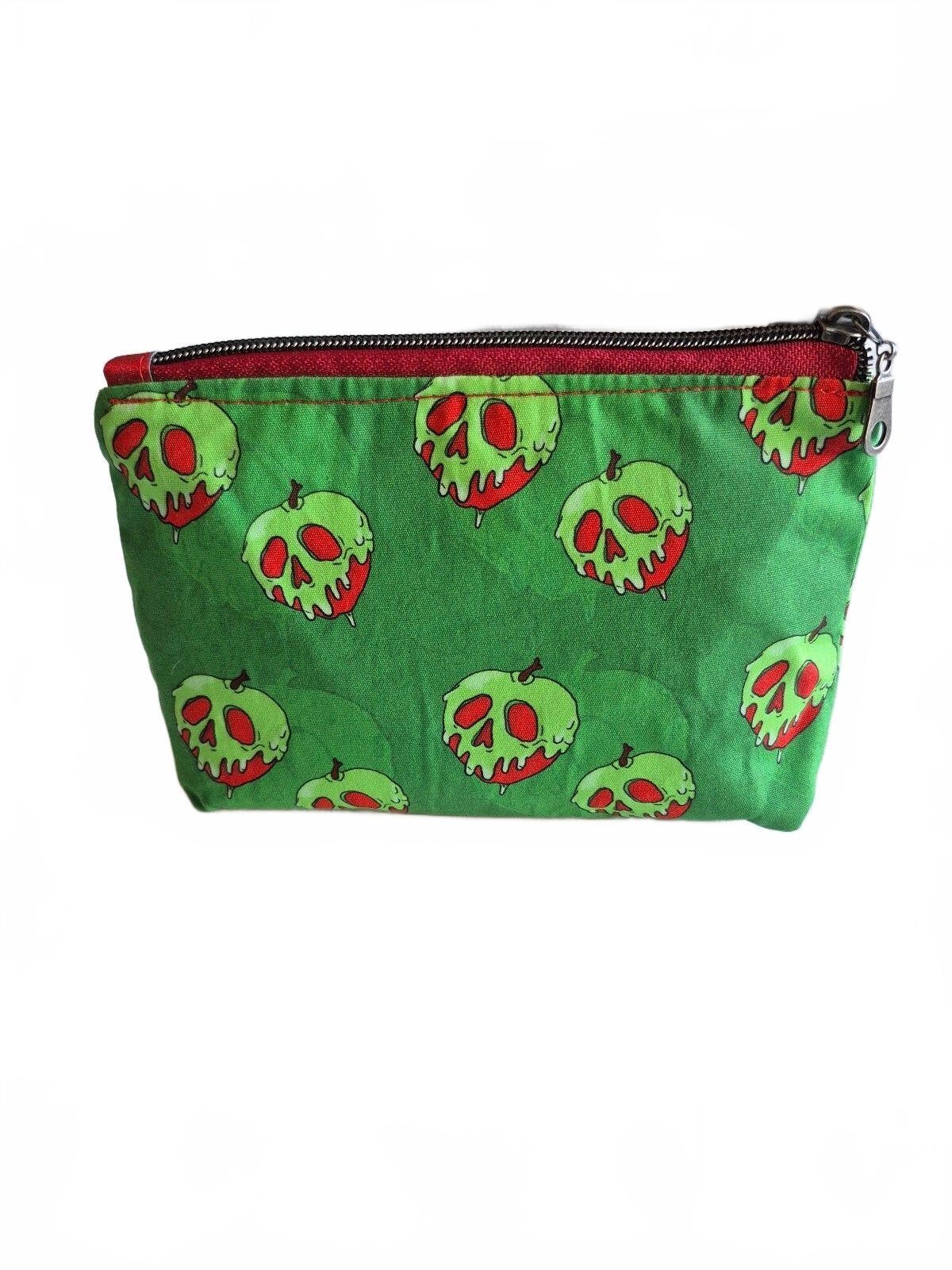 poison red apple on green cotton fabric Cosmetic Pouch, w/ red canvas lining