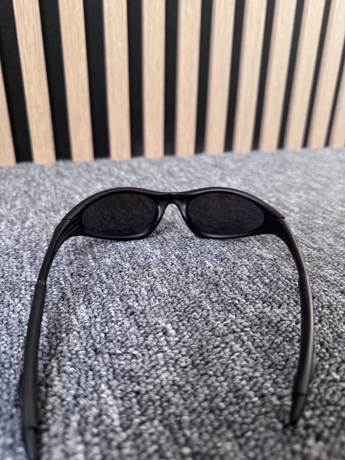 Oakley Minute sunglasses unisex black frame with blue see trough lenses