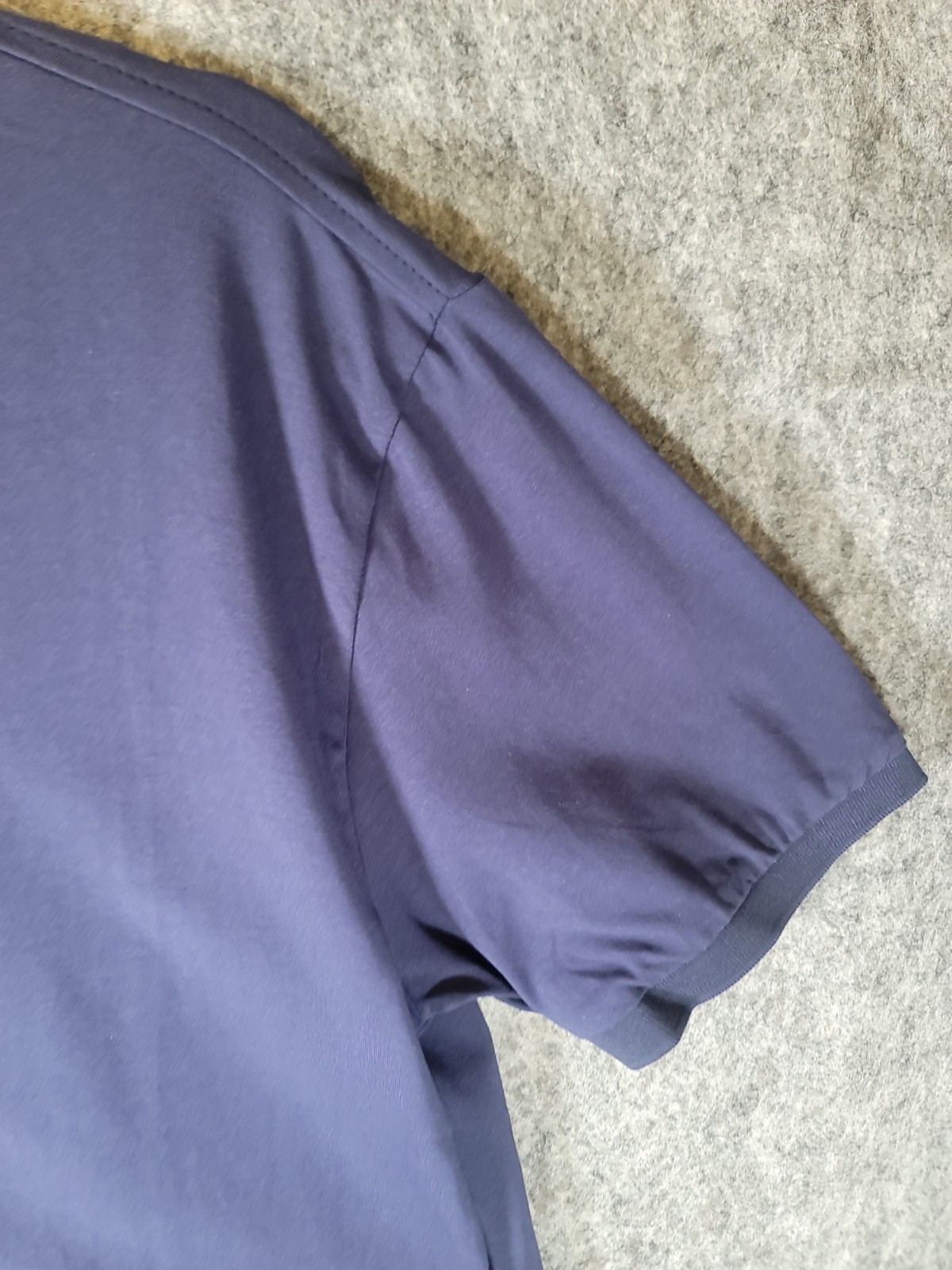 Men’s navy blue Maximos USA Stretch polo shirt features a 3-button placket L